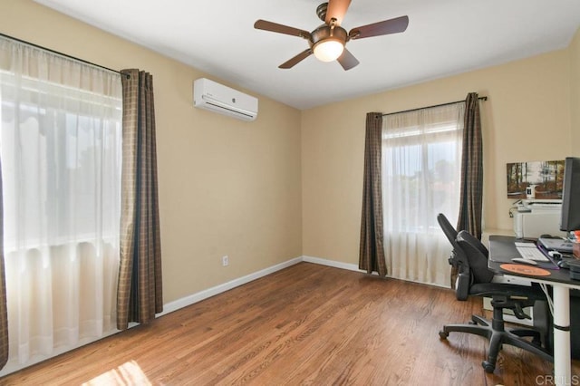 6038 Bradford St, San Diego, CA 92115 - office featuring a wall unit AC, wood finished floors, and ceiling fan