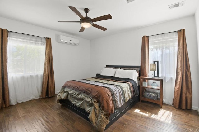 6038 Bradford St, San Diego, CA 92115 - bedroom with a wall mounted AC, multiple windows, and hardwood / wood-style floors