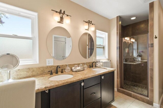 6038 Bradford St, San Diego, CA 92115 - full bathroom with double vanity, a shower stall, and tile patterned floors
