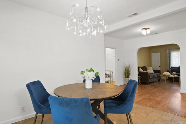 6038 Bradford St, San Diego, CA 92115 - dining space with arched walkways and a chandelier