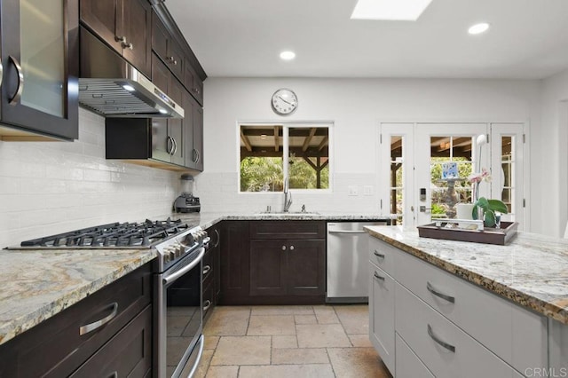 6038 Bradford St, San Diego, CA 92115 - kitchen featuring stainless steel appliances, under cabinet range hood, recessed lighting, decorative backsplash, and dark brown cabinetry
