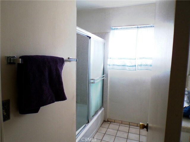662 Kempton Ave, Monterey Park, CA 91755 - full bathroom with tile patterned floors and bath / shower combo with glass door
