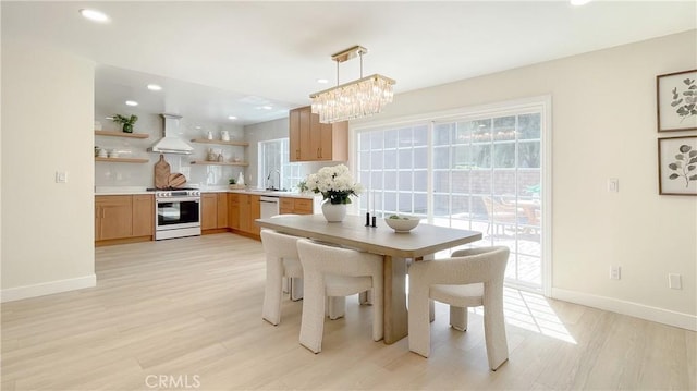 4 Skipper, Irvine, CA 92604 - dining space featuring healthy amount of natural light, light wood-style floors, a chandelier, and recessed lighting
