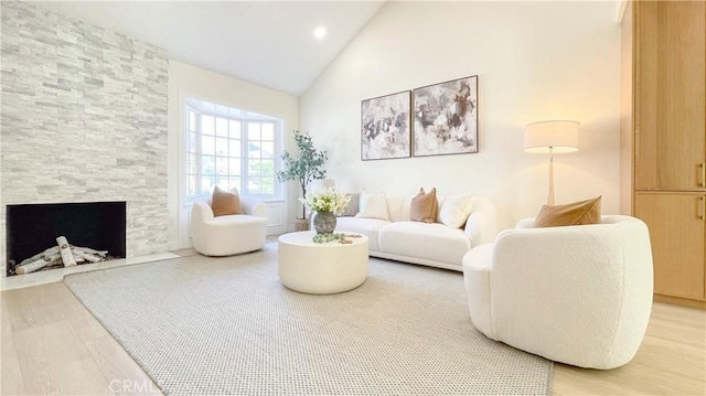 4 Skipper, Irvine, CA 92604 - living area with high vaulted ceiling, light wood-style floors, a fireplace, and recessed lighting