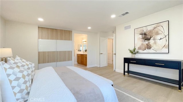 4 Skipper, Irvine, CA 92604 - bedroom with light wood-style floors, recessed lighting, and connected bathroom