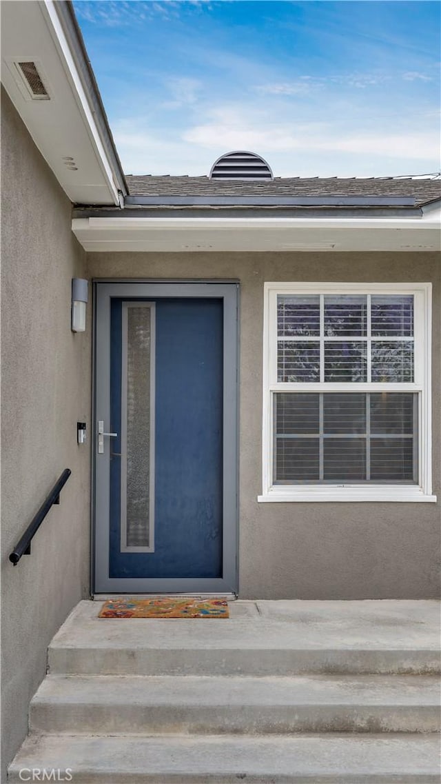 5202 E Conant St, Long Beach, CA 90808 - doorway to property with stucco siding