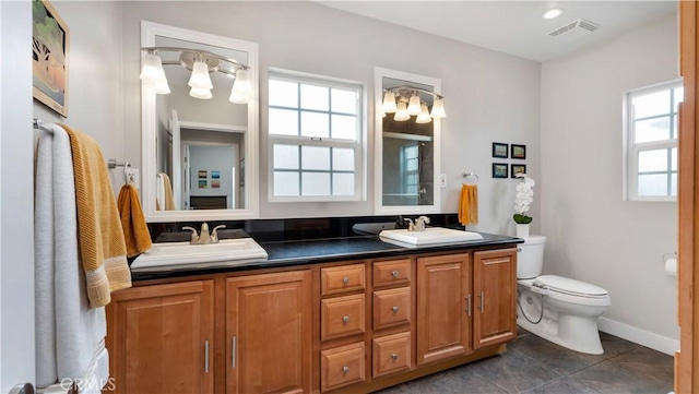 5202 E Conant St, Long Beach, CA 90808 - full bathroom with healthy amount of natural light, double vanity, a chandelier, and tile patterned floors