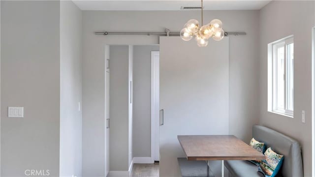 5202 E Conant St, Long Beach, CA 90808 - dining room featuring a chandelier and plenty of natural light