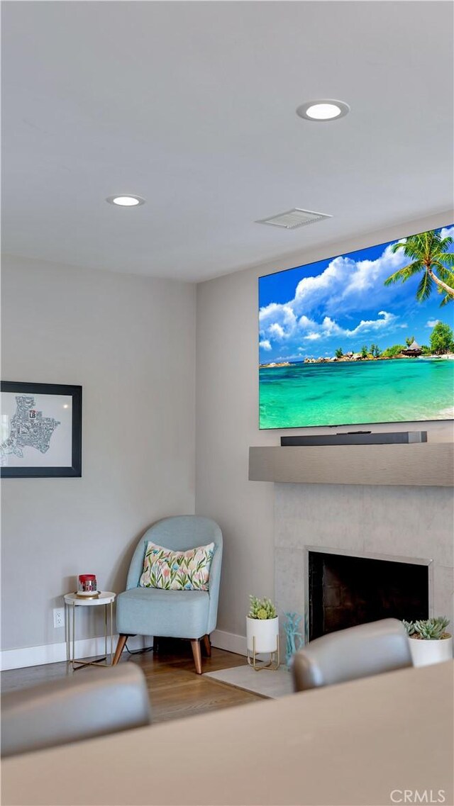 5202 E Conant St, Long Beach, CA 90808 - living area featuring a fireplace, wood finished floors, and recessed lighting