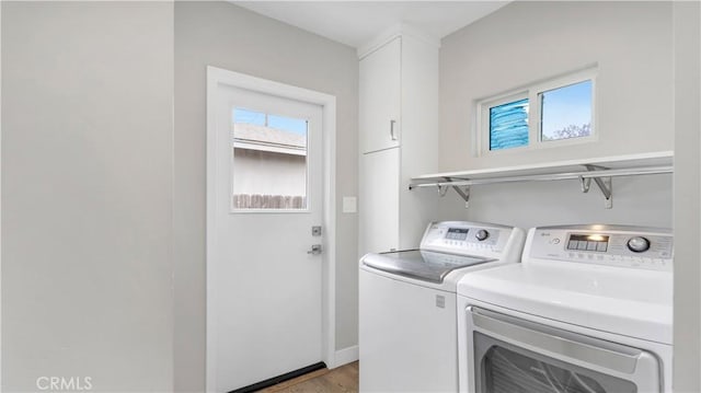 5202 E Conant St, Long Beach, CA 90808 - washroom featuring cabinet space, washing machine and dryer, and light wood-style flooring