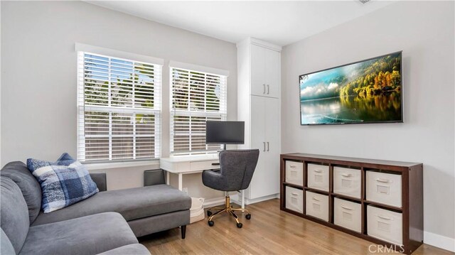 5202 E Conant St, Long Beach, CA 90808 - office area featuring light wood-style flooring and baseboards
