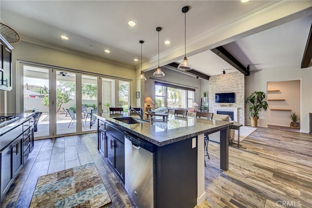 35115 Mahogany Glen Dr, Winchester, CA 92596 - kitchen with stainless steel dishwasher, french doors, crown molding, dark stone counters, and wood finished floors