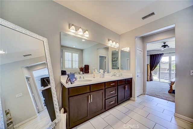 35115 Mahogany Glen Dr, Winchester, CA 92596 - bathroom with double vanity, healthy amount of natural light, ensuite bath, and ceiling fan