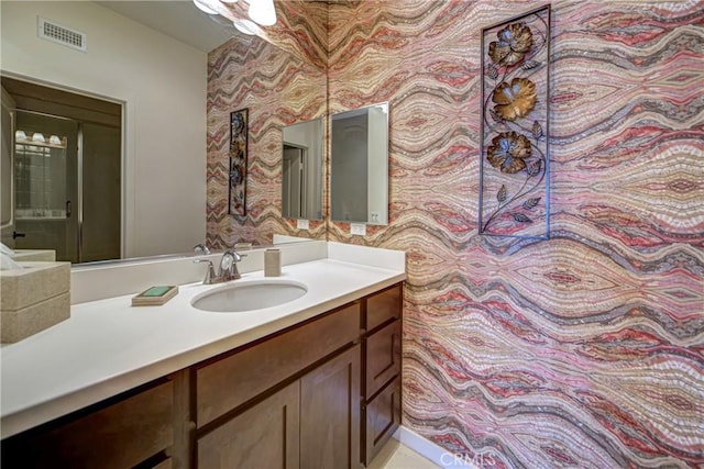 35115 Mahogany Glen Dr, Winchester, CA 92596 - bathroom with wallpapered walls and vanity