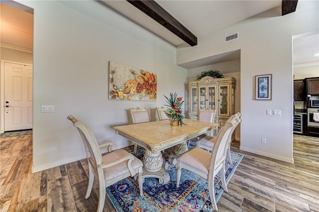 35115 Mahogany Glen Dr, Winchester, CA 92596 - dining area with wood finished floors, beam ceiling, and ornamental molding