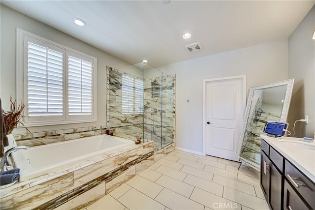 35115 Mahogany Glen Dr, Winchester, CA 92596 - bathroom featuring a bath, vanity, a stall shower, recessed lighting, and tile patterned flooring