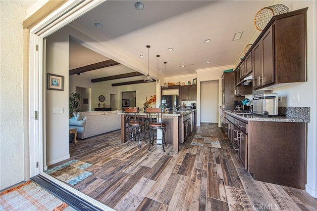 35115 Mahogany Glen Dr, Winchester, CA 92596 - kitchen featuring dark brown cabinetry, black refrigerator with ice dispenser, dark wood-style floors, open floor plan, and beam ceiling