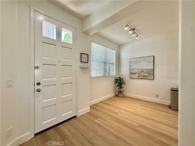 13390 Savanna, Tustin, CA 92782 - foyer entrance featuring light wood finished floors, rail lighting, and healthy amount of natural light