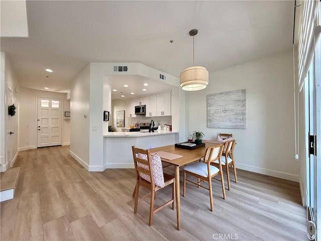 13390 Savanna, Tustin, CA 92782 - dining space with light wood-style floors and recessed lighting