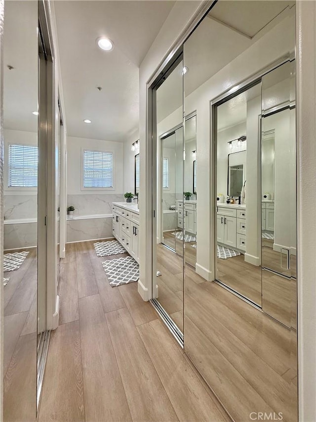 13390 Savanna, Tustin, CA 92782 - bathroom featuring a bath, vanity, wood finished floors, and recessed lighting