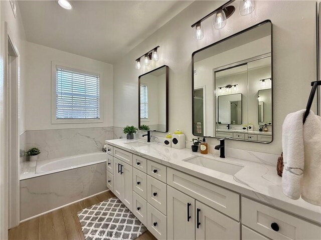 13390 Savanna, Tustin, CA 92782 - full bathroom with a garden tub, wood finished floors, and double vanity