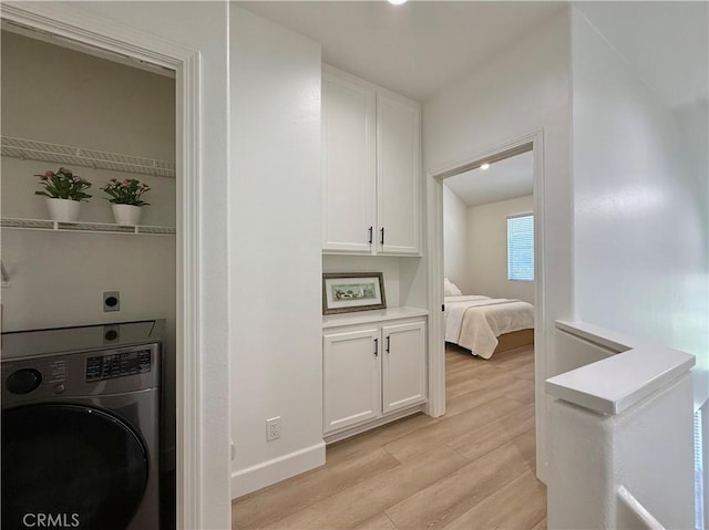 13390 Savanna, Tustin, CA 92782 - laundry area with washer / clothes dryer and light wood-style flooring