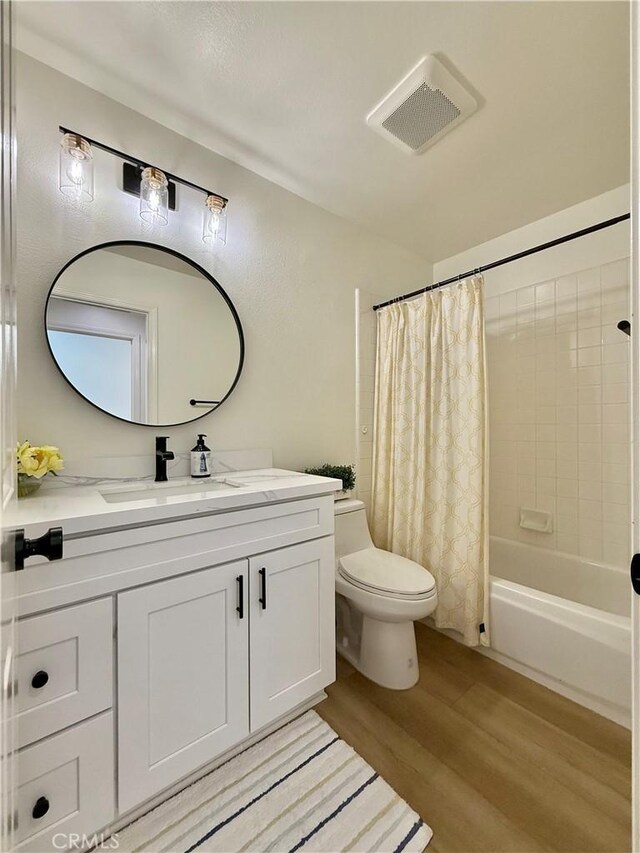 13390 Savanna, Tustin, CA 92782 - bathroom with wood finished floors, vanity, and shower / bath combo with shower curtain