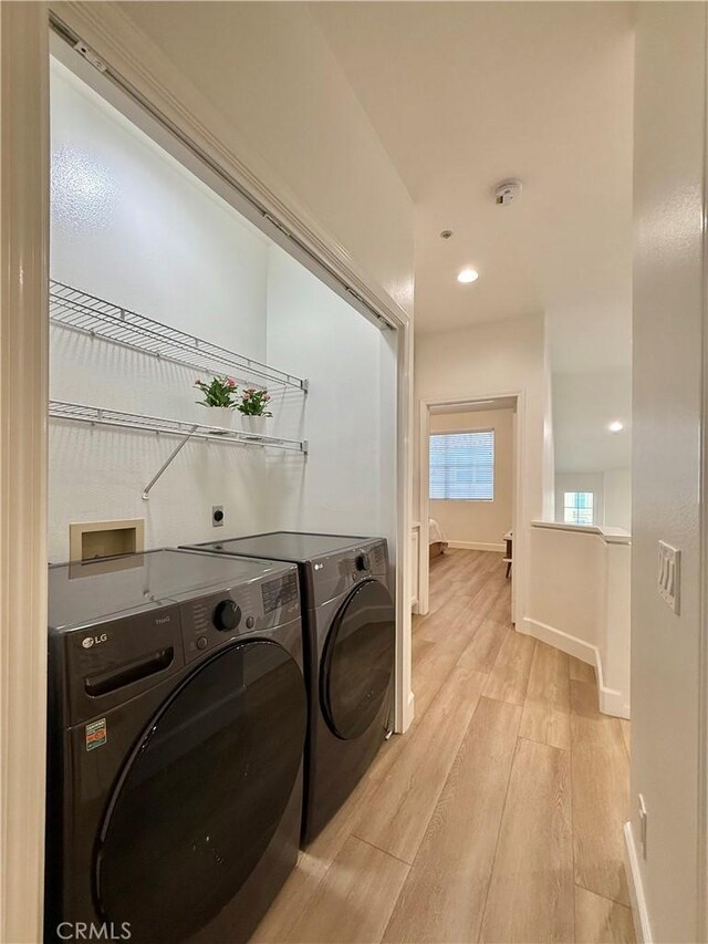 13390 Savanna, Tustin, CA 92782 - laundry area featuring independent washer and dryer, light wood-type flooring, and recessed lighting