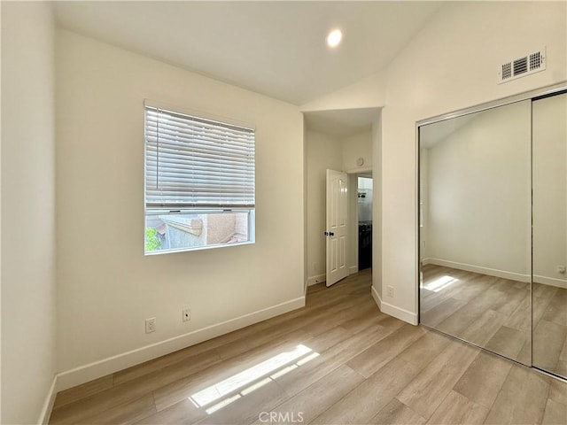 13390 Savanna, Tustin, CA 92782 - unfurnished bedroom featuring light wood-style floors, a closet, lofted ceiling, and recessed lighting