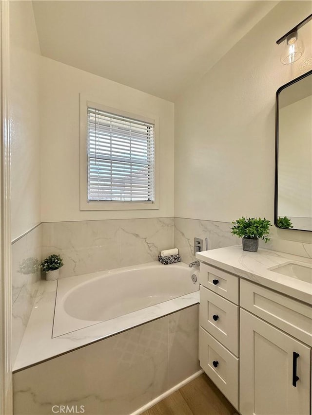 13390 Savanna, Tustin, CA 92782 - bathroom featuring vanity, a garden tub, and wood finished floors