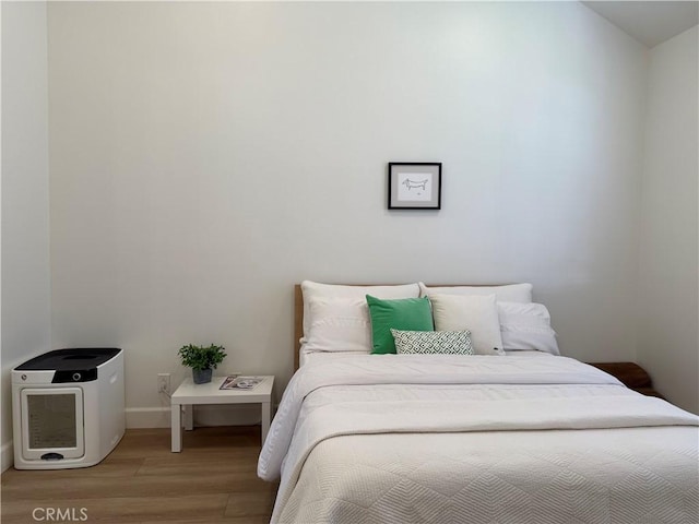 13390 Savanna, Tustin, CA 92782 - bedroom with light wood-type flooring and baseboards
