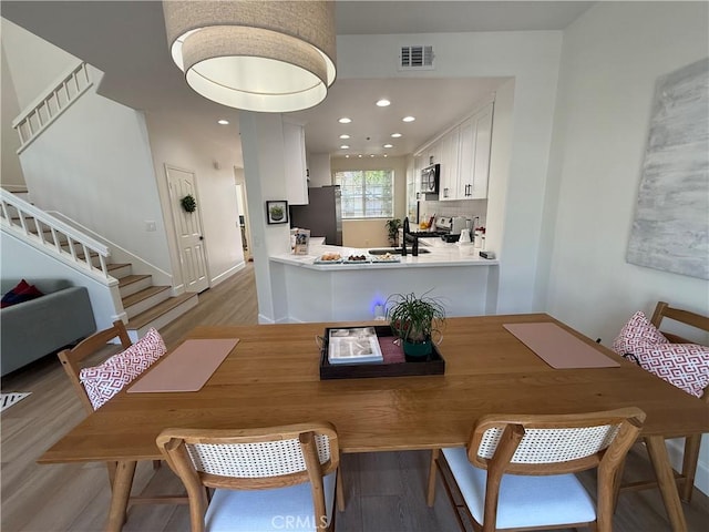 13390 Savanna, Tustin, CA 92782 - dining space with stairs, light wood-type flooring, and recessed lighting