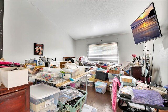 12161 Napoli Dr, Cerritos, CA 90703 - living area featuring wood finished floors and vaulted ceiling