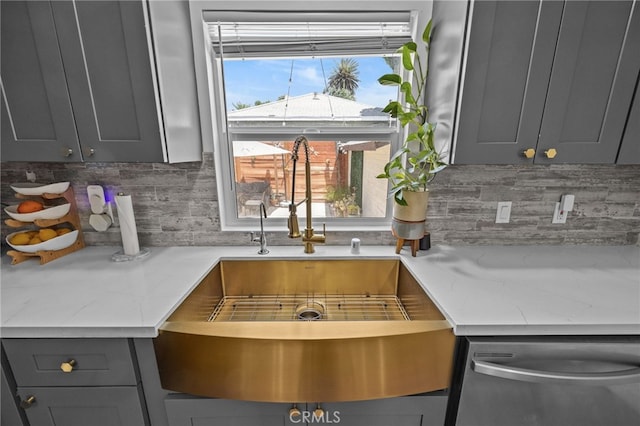 156 W Wabash St, San Bernardino, CA 92405 - kitchen with gray cabinetry, decorative backsplash, stainless steel dishwasher, and light stone countertops