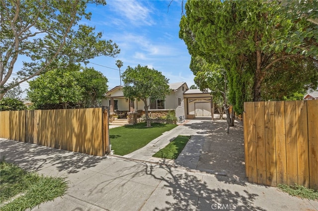 156 W Wabash St, San Bernardino, CA 92405 - view of property hidden behind natural elements with a carport and concrete driveway
