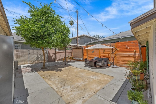 156 W Wabash St, San Bernardino, CA 92405 - fenced backyard with an outdoor hangout area and a patio