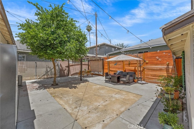 156 W Wabash St, San Bernardino, CA 92405 - fenced backyard featuring outdoor lounge area and a patio