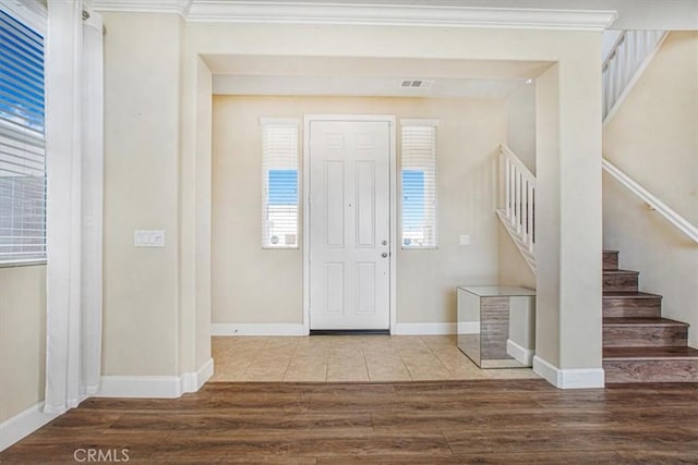 29234 St Andrews, Lake Elsinore, CA 92530 - foyer entrance featuring stairway, wood finished floors, and ornamental molding