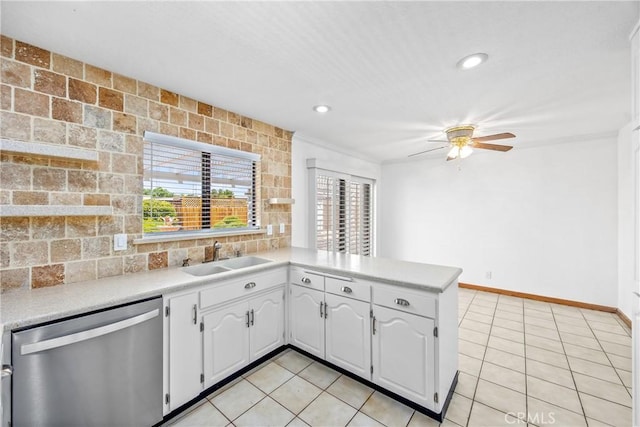 16048 Wintun Rd, Apple Valley, CA 92307 - kitchen featuring stainless steel dishwasher, light countertops, a ceiling fan, a peninsula, and light tile patterned flooring