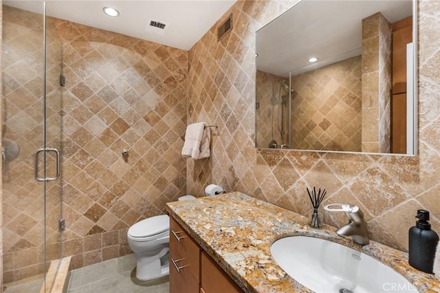 1131 Alta Loma Rd Unit 207, West Hollywood, CA 90069 - bathroom featuring tile walls, vanity, a stall shower, tile patterned floors, and recessed lighting