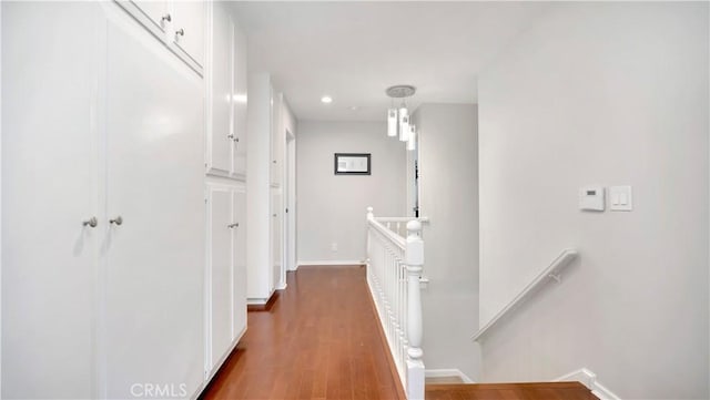 2867 N Shady Glen Ln, Orange, CA 92867 - corridor featuring an upstairs landing, dark wood-style flooring, and recessed lighting