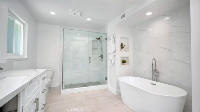 2867 N Shady Glen Ln, Orange, CA 92867 - bathroom featuring vanity, a freestanding tub, a marble finish shower, and recessed lighting