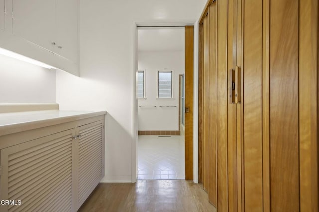 1613 Muir St, Fillmore, CA 93015 - corridor featuring light wood-style flooring and baseboards