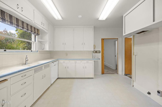 1613 Muir St, Fillmore, CA 93015 - kitchen with white dishwasher, white cabinetry, backsplash, and open shelves