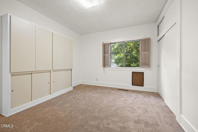1613 Muir St, Fillmore, CA 93015 - unfurnished bedroom featuring a textured ceiling, carpet flooring, and a closet