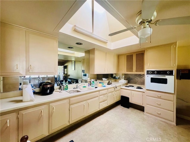13240 El Dorado Dr Unit 187I, Seal Beach, CA 90740 - kitchen with white appliances, a ceiling fan, light countertops, and backsplash