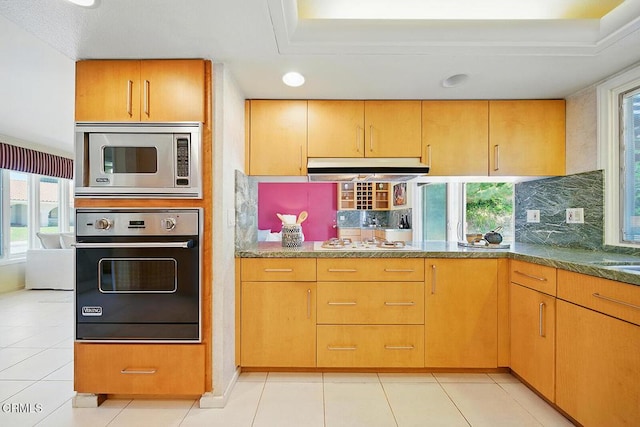 3121 Kingridge Way, Glendale, CA 91206 - kitchen featuring wall oven, stainless steel microwave, under cabinet range hood, tasteful backsplash, and white gas cooktop