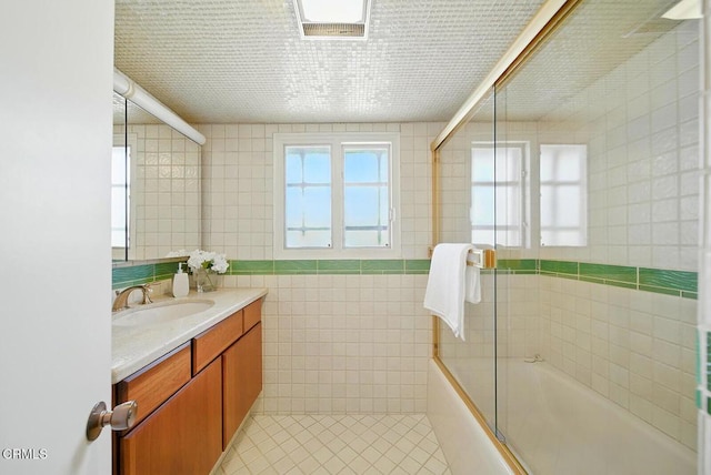 3121 Kingridge Way, Glendale, CA 91206 - bathroom with tile walls, vanity, combined bath / shower with glass door, and tile patterned floors