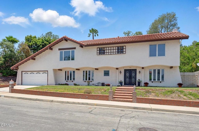 3121 Kingridge Way, Glendale, CA 91206 - mediterranean / spanish-style home featuring french doors, stucco siding, a tile roof, and driveway