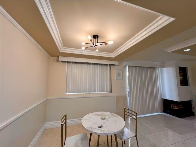 28004 Western Ave S Unit 121, San Pedro, CA 90732 - tiled dining area with a raised ceiling, a chandelier, and crown molding